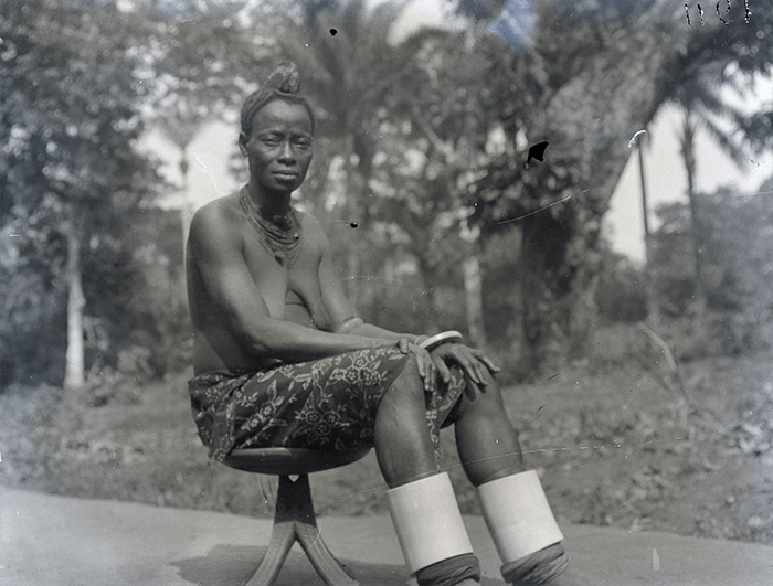 Full view of the elder on the traditional stool