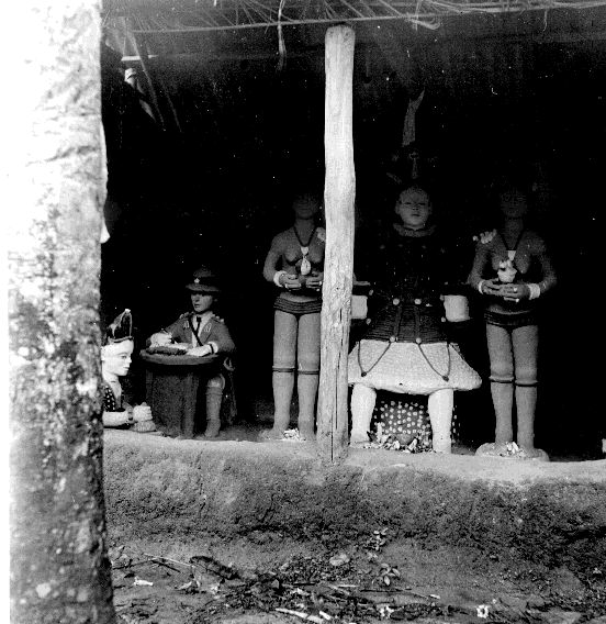 Mud sculptures of a Chief, attendants, and a Commissioner of Police in North Ika.