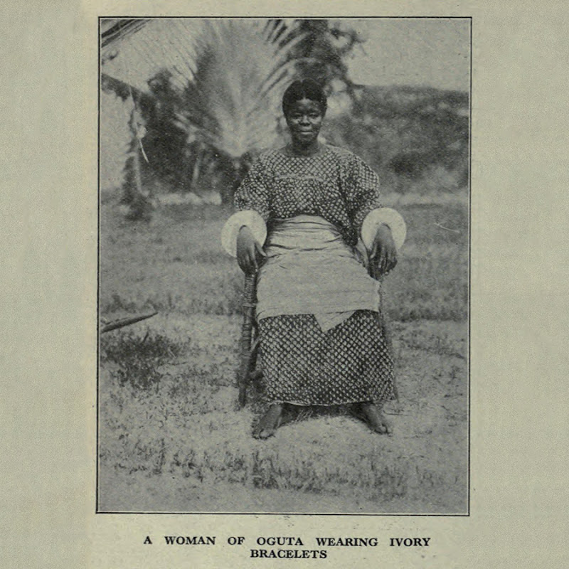 Seated woman from Ụgwụtā wearing ivory bracelets.